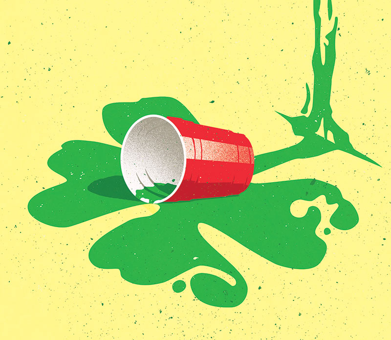 Solo cup spilled green beer shaped like shamrock